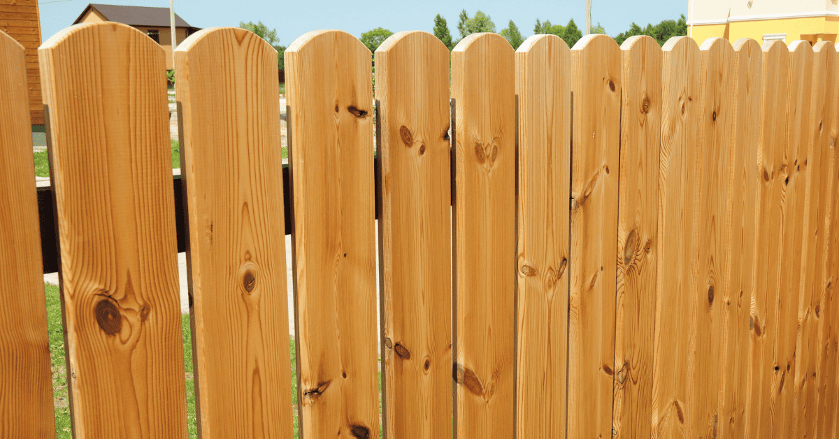 Close view of dog-ear wood fence boards