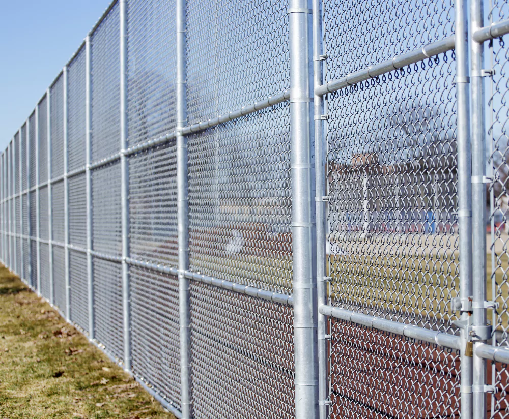 Chain link fence surrounding school athletic complex
