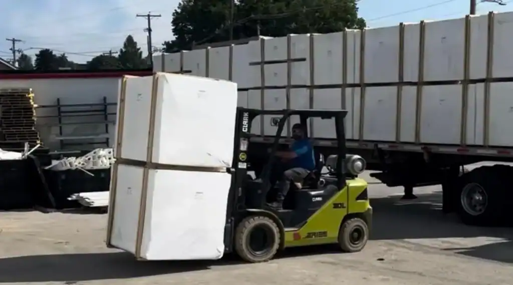 Tractor trailer unloading American made vinyl fence materials at Future Solutions Fence facility in York PA