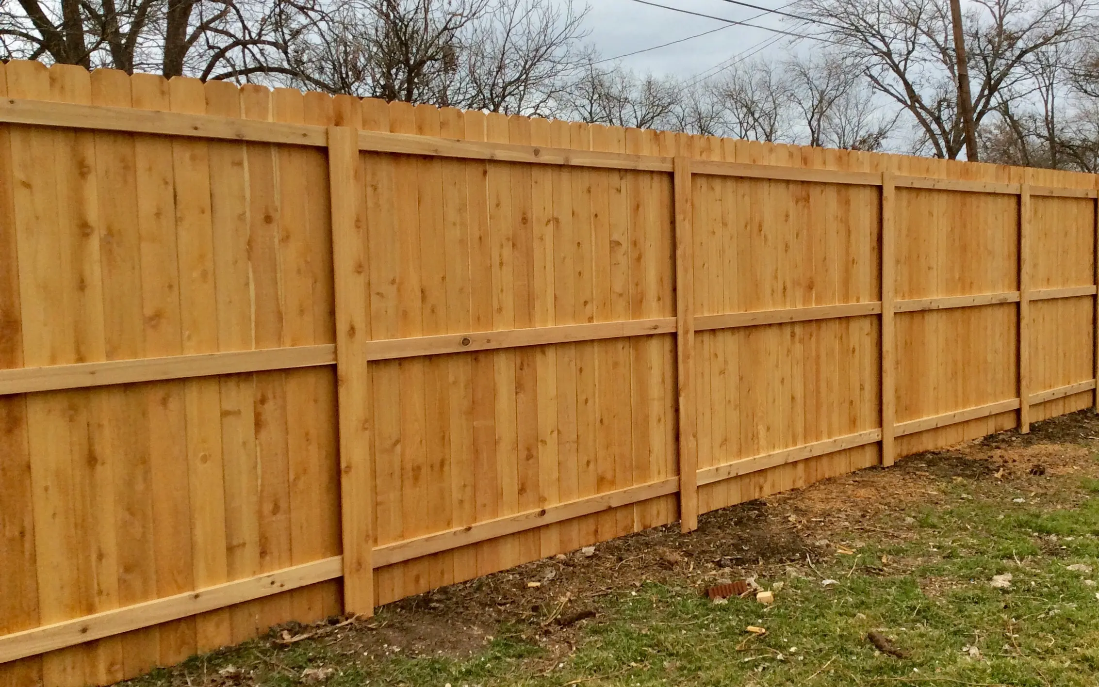 Tall solid board wood privacy fence, installed by Future Solutions Fence