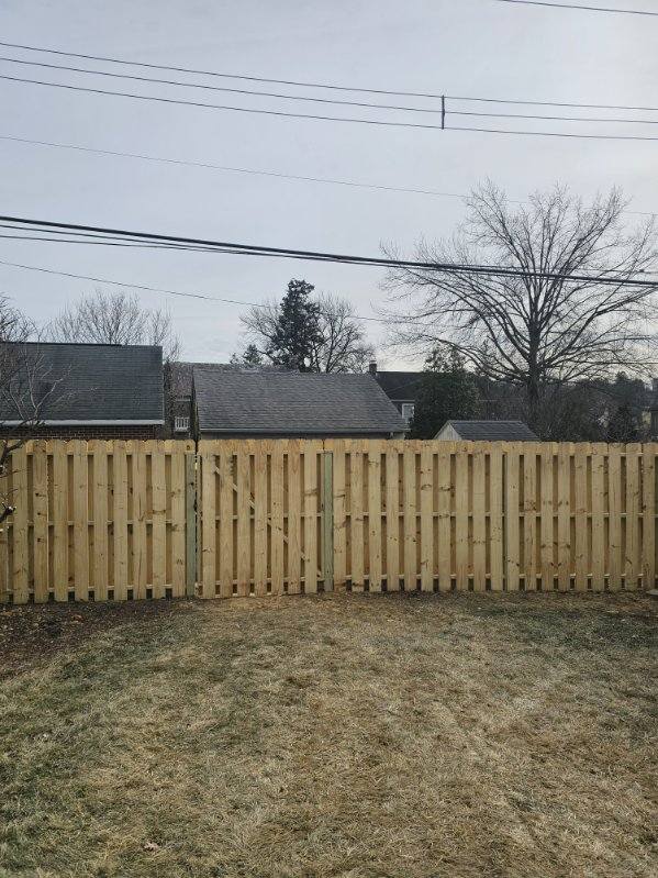 Wood fence running along a rear property boundary, installed by Future Solutions Fence